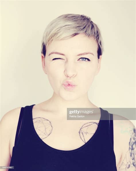 Tattooed Woman Pulling A Funny Face Photo Getty Images