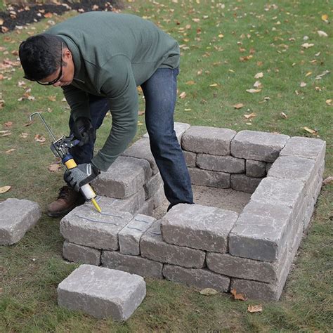 The noob attack can be found in this stage. Laying third row of retaining wall blocks. | Custom fire pit, Fire pit, Fire pit backyard