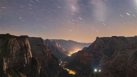 Download 1366x768 Wallpaper Valley Mountains City Starry Sky