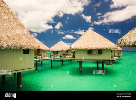 Clouds Over The Beach Huts Bora Bora Tahiti French Polynesia Stock