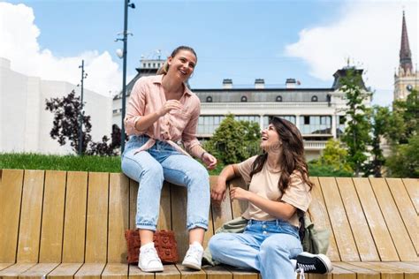 144 Two Best Friends Sitting Park Bench Stock Photos Free And Royalty
