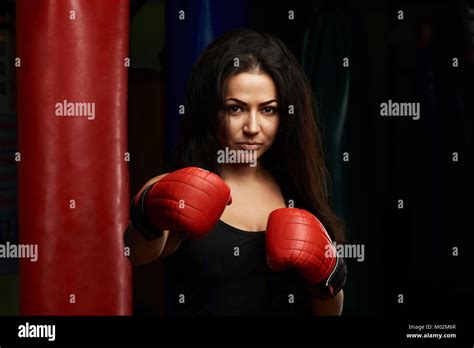 Brunette Girl Making Boxing Punch Portrait Of Young Boxing Woman Stock