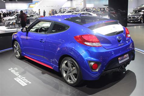 It's the most affordable model. 2014 Hyundai Veloster Turbo R-Spec rear quarter