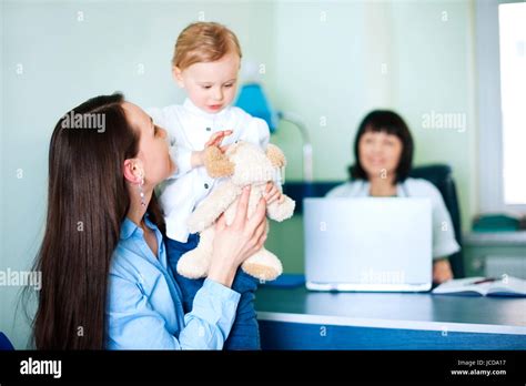 Mother With Her Daughter At Doctors Office Stock Photo Alamy
