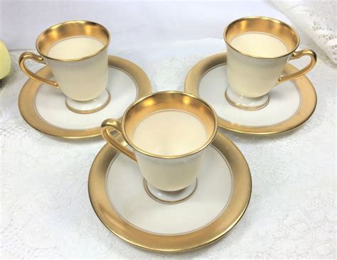 A floral decoration on ceramics bases on botanical illustrations dating from 1720's. Set of 3 Lenox Footed Demitasse Cup & Saucers Circa 1906 ...