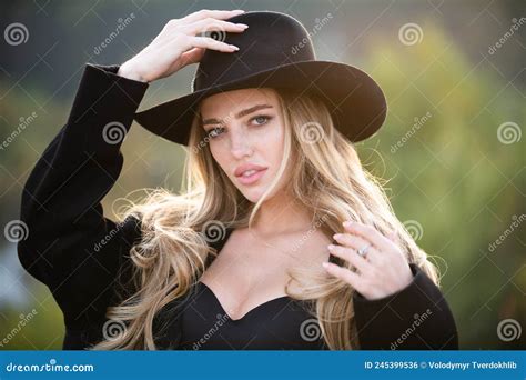 Portrait Of Beautiful Young Woman In Wide Broad Brim Hat Outdoor