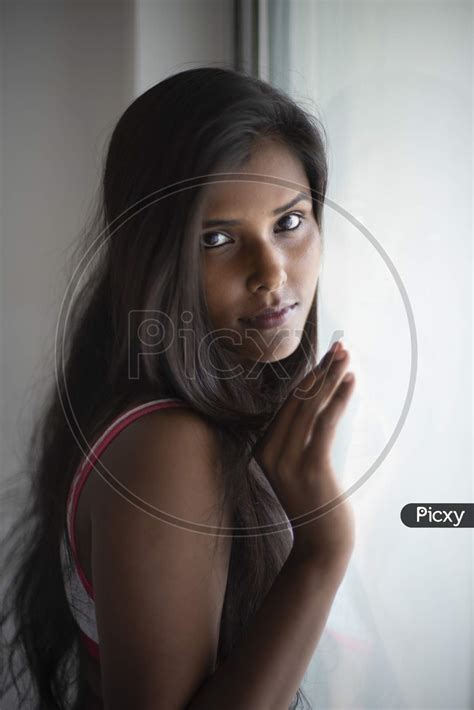 Image Of Portrait Of An Attractive Young Brunette Dark Skinned Indian Bengali Girl In Western