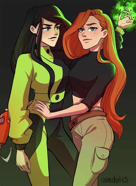 Two Women Standing Next To Each Other One With Red Hair And The Other Green