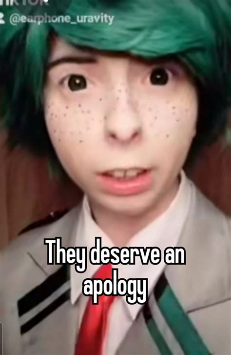 A Person With Green Hair Wearing A Suit And Tie