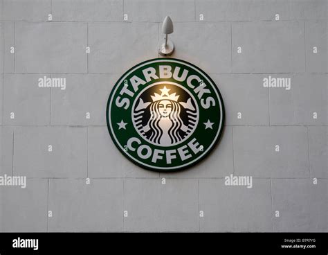 A Starbucks Coffee Sign On The Side Wall Of A Branch In Londons West