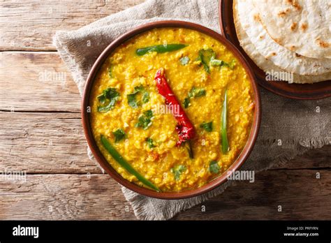 indian popular food dal tadka curry served with roti flatbread close up on the table horizontal