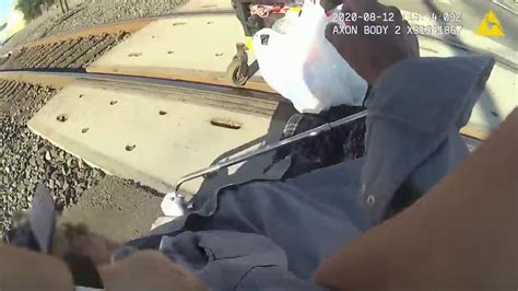 Video Lodi Officer Narrowly Saves Man In Wheelchair Stuck On Train Tracks Youtube