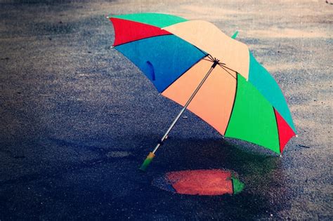 Premium Photo Umbrella On Rainy Day