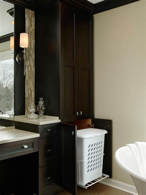 This stunning new product has a modern, stylish design, the priano tall cabinet with plane board. Hamper Hideaway in Custom Bathroom Cabinet | HGTV