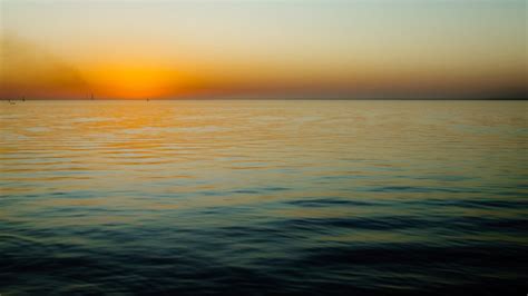 Beautiful Sunset Over The Sea Calm Water Hd Wallpaper