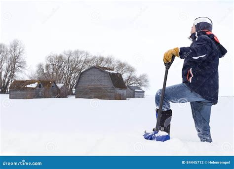 Man Standing In Deep Snow With Shovel In Hand Stock Photo Image Of