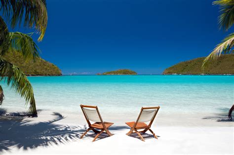 Chairs Between Palm Trees At The Virgin Islands Beach Travelfinders