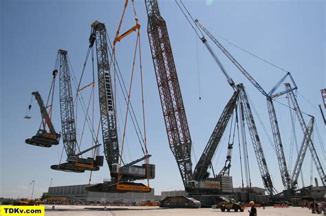A Crane Is Lifted By A Real Crane Which Is Lifted By Another Crane Which Is Lifted By Another