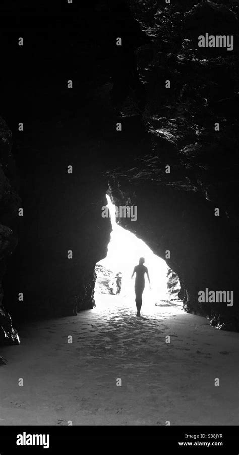 Graphic Image Of Girl Walking Through Cave Only Showing Silhouette