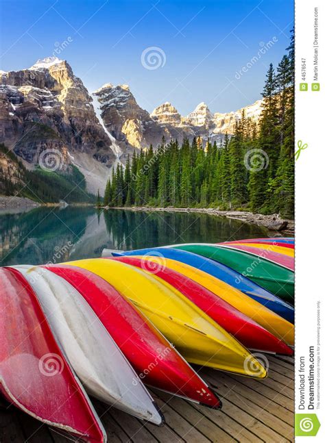 Landscape View Of Moraine Lake With Colorful Boats Rocky