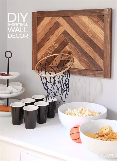 A Basketball Themed Wall Decor With Cups And Bowls In Front Of The