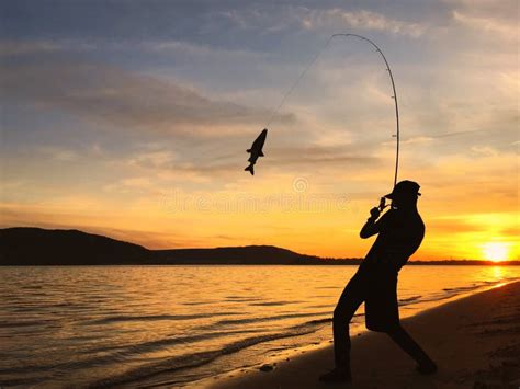 Young Man Fishing At Sunset Stock Image Image Of Activity Golden