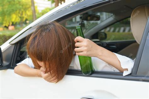 premium photo drunk asian woman feels dizzy after too much drinking alcohol and driving car