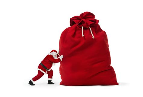 Santa Claus Pushing Huge Bag Of Christmas Ts Stock Photo Download