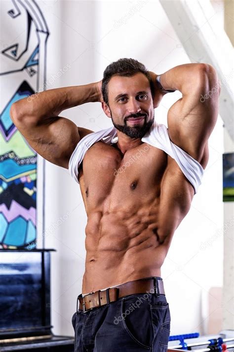 Muscle Man Poses Stock Photo By ©annamoskvina 107950394