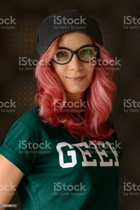Beautiful Nerd Woman With Pink Hair Wearing Geek Shirt And Eyeglasses