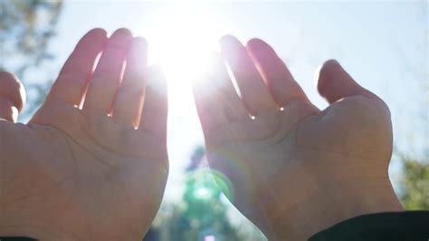 A person raises hands towards the sky and makes a prayer, muslim prayer ...