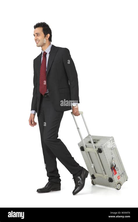 Indian Businessman Walking With Suitcase Stock Photo Alamy