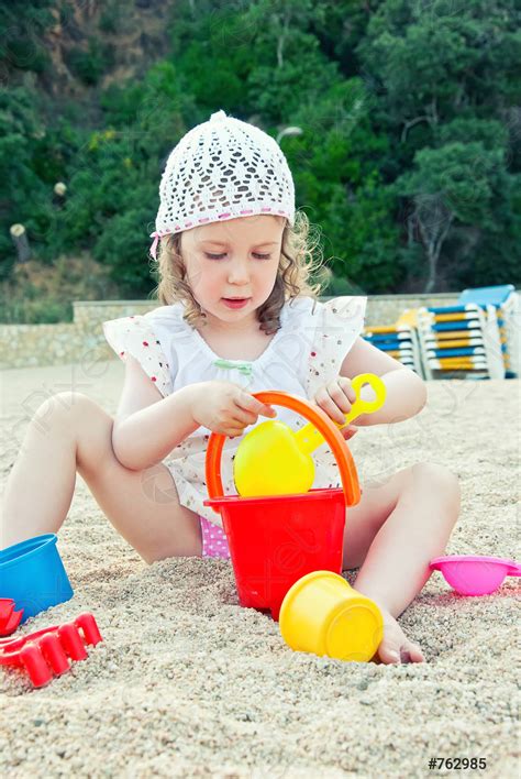 Little Girl Playing With Toys On The Beach Stock Photo 762985