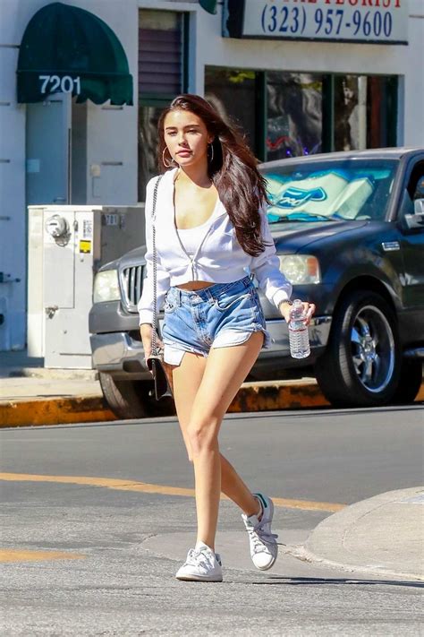 Madison Beer Wears A White Shirt And Denim Shorts As She Steps Out To