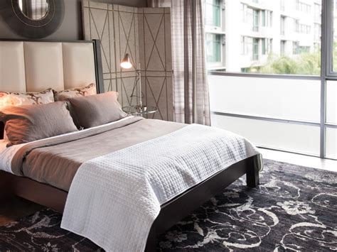 Measure your floor and furniture and visit one of our showrooms to see our area rug. Luxurious Black Area Rug in Midcentury Modern Bedroom | HGTV
