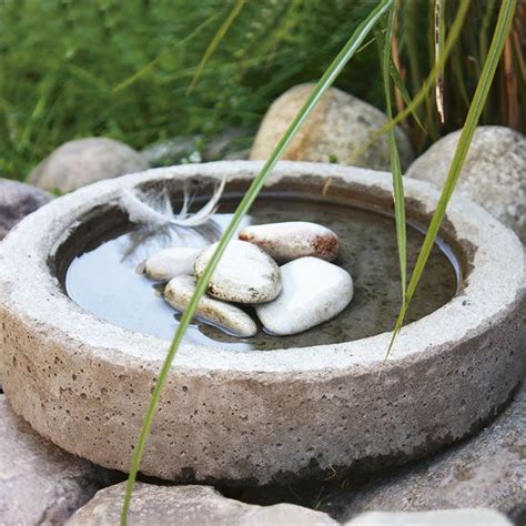 I love the design of it. How to Make Your Own Easy Concrete Planters | Diy concrete planters, Concrete bird bath ...