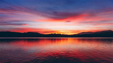 Download Wallpaper 1600x900 Lake Sunset Horizon Sky Trees Twilight