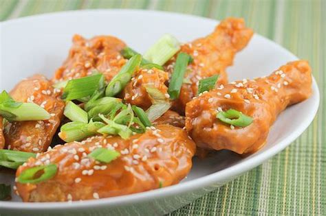 Spray rack with nonstick cooking spray. ASIAN CHICKEN WINGS - peanut butter, Hot sauce, brown ...