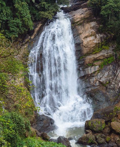 A Beautiful Large Waterfall Cascading Down Several Hundred Feet On A