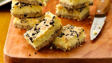 Rainbow sprinkles add pretty colors. Cookies and Creme Cheesecake Bars recipe from Betty Crocker