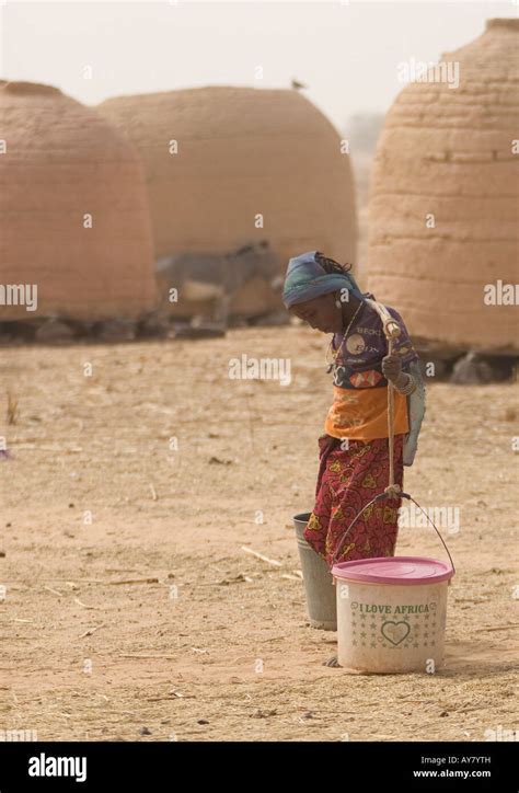Young Hausa Girl Carrying Water To Her Village Dandoutchi Niger West