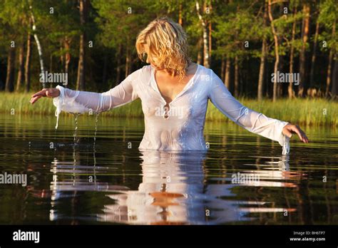 Woman Swimming In Dark Forest Lake Nice Reflection From Water Stock