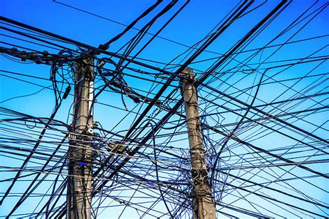 Messy Electrical Cables And Wires On Electric Pole Stock Photos