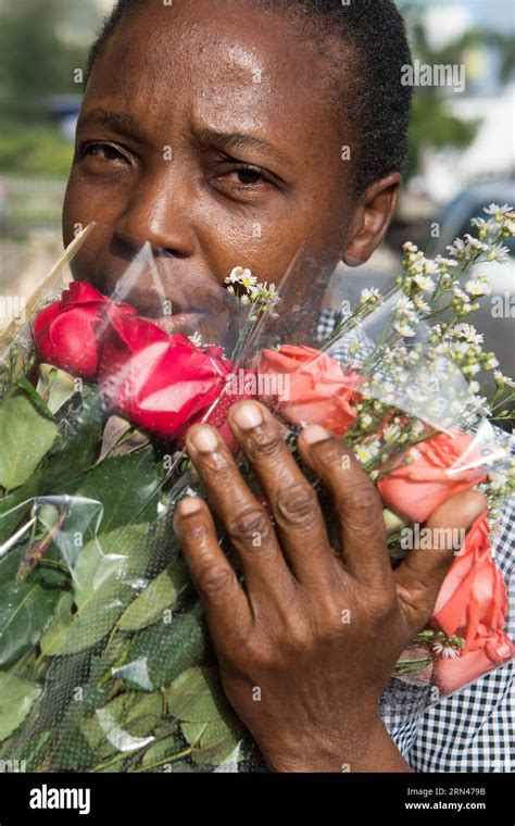 Georgie Charlot Poses With A Bouquet Of Flowers In Port Au Prince