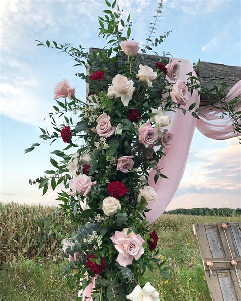 Wooden Arch With Blush Chiffon Ruscus Burgundy Carnations Faith