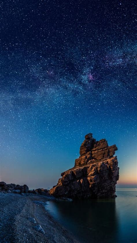 Starry Night Over Rock Formations By The Pacific Ocean Dalian