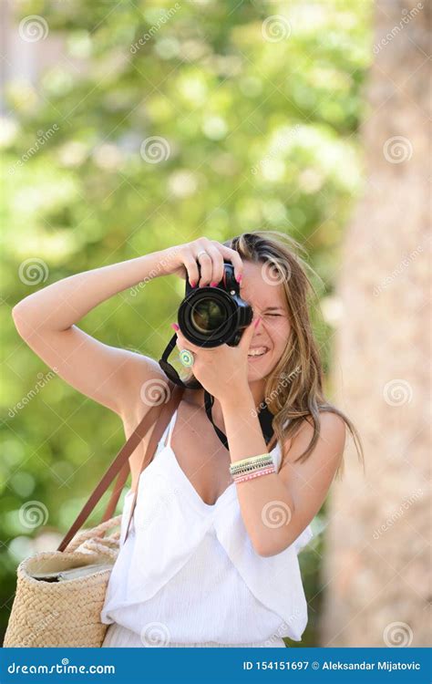 Happy Woman Photographer Holding A Dslr Camera Stock Image Image Of Enjoy Ocean 154151697