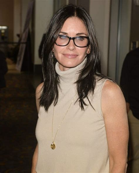 Courteney Cox Hairstyle Turtleneck And Black Glasses