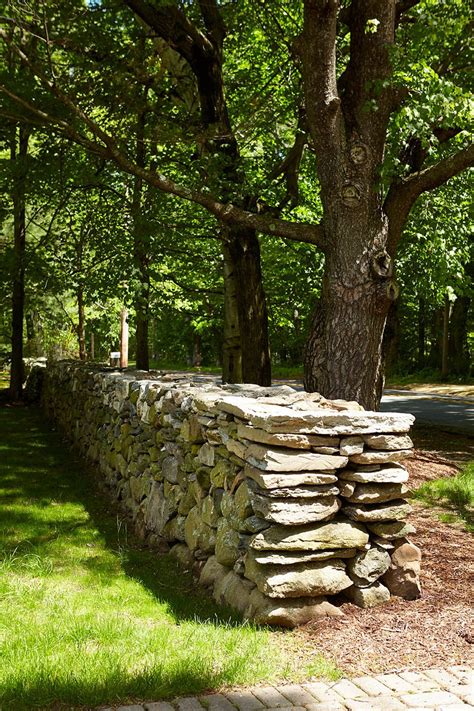 New England Stone Wall Was Recreated To Match Old Stone With The New