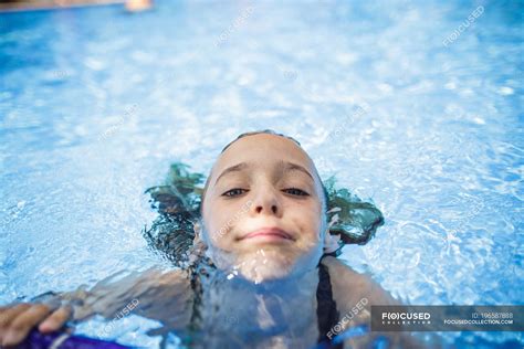 A Girl Is Having Fun In A Swimming Pool During Vacation — Hobbies